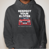 a person wearing a grey hoodie with a red car and white text
